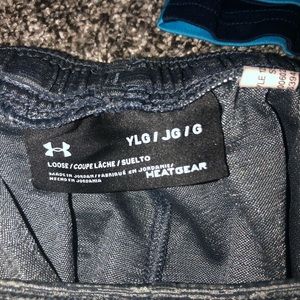 2 pairs of boys youth under armour shorts.